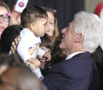 William d Lewis the vindicator   Bill Clinton holds a baby during rally 102912 at Covelli.