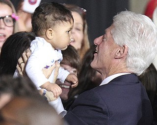 William d Lewis the vindicator   Bill Clinton holds a baby during rally 102912 at Covelli.
