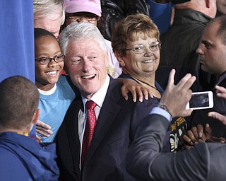 William d Lewis the vindicator   Bill Clinton poses for a photo during rally 102912 at Covelli.