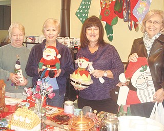 Sue Stoddart, left, Carol Olson, Sue Pechkurow and Linda Matheny show items for the Upton Christmas garage sale. The sale will be from 9 a.m. to 4 p.m. Nov. 16 and 17 at Upton House, 380 Mahoning Ave. NW, Warren. Donations are welcome and will be accepted from 9 a.m. to noon Nov. 12 or 1 to 4 p.m. Nov. 15. Christmas decorations, toys, housewares and jewelry are some of the items needed. Proceeds will benefit Upton House. Members willing to volunteer can email institches5848@aol.com. For information visit www.uptonhouse.org.