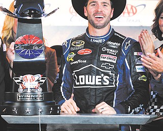 Jimmie Johnson is all smiles in Victory Row following Sunday’s win at Texas Motor Speedway. It was the second victory in a row for Johnson, who is the Sprint Cup points leader with two races to go.
