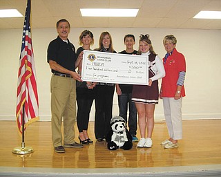 Boardman Lions Club recently made a $500 donation to the Boardman Center Middle School PANDA organization. From left to right are Terry Shears, Boardman Lions president; Mindy DePietro, Boardman Center Middle School counselor; Beth Bonish, PANDA coordinator; Bobby Morren and Madeline Kvasnasky, eighth-grade PANDA leaders; and Kris Dailey, Boardman Lions board member. PANDA, which stands for Prevent and Neutralize Drug and Alcohol Abuse, is no longer funded through the state. It is a program of Meridian Community Care that encourages responsible decisions about bullying, depression, violence, self-esteem and other issues and it meets every other Wednesday at the school.