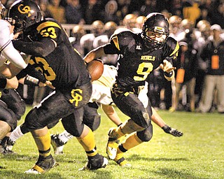 Crestview’s Josh McDade (53) sets a block for Collin Gilbert (9) during Saturday’s Region 17 matchup against St. Thomas Aquinas at Crestview High School.
