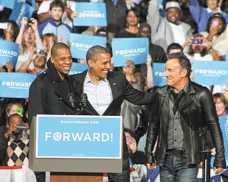 President Barack Obama is joined by musicians Jay-Z and Bruce Springsteen during an election eve rally Monday in Columbus. More than 15,000 people turned out for the event.