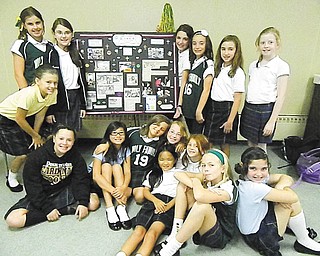 The fifth- and sixth-grade girls of Holy Family School, Poland, who are members of Acts of Random Kindness (ARK), joined together recently to collect gently used backpacks for Easter Seals preschool students and gently used clothing for Struthers First Ward Block Watch Committee. Standing, from left, are Braiden Forsyth, Madelyn Filisky, Audra Pesko, Quinn Barton, Aubrey McClellan, Ashley Angiolelli and Ashley Thompson, and sitting are Nicole Rotunno, Eve Cardello, Isabella Beato, Margaret Faur, Emily Testa, Mya Blanco, Mariah Farragher and Alyssa Masternick.