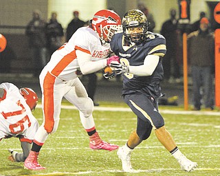 Brookfield’s Ryan Mosora (3) tries to break away from Edgewood defender Anthony Monda during the first quarter of the Division IV, Region 13 quarterfi nal at Arrowhead Stadium in Girard. Mosora has scored 156 points for the Warriors, who are preparing for the next round of playoff s this Friday against Akron Manchester.