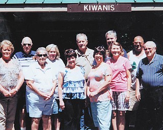 Members of Austintown Kiwanis recently had their annual picnic at Austintown Kiwanis Club Pavilion, built in the 1950s, in Austintown Township Park. Those who attended are, in front from left, Barb Kliner; Caryl Kloss; Karen Schnurrenberger; Mary Ann Herschel, president; Jennifer Kurish; and guest Chuck Whitman. In back are Bob Kloss, treasurer; Carole Powers, secretary; Dave Schnurrenberger; Mike Kurish; and Todd Shaffer, park superintendent. The club meets every Wednesday at noon at Austintown Community Church and guests are welcome for lunch. For information about what the club does in the community call 330-793-3087.
