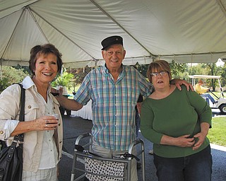 Whispering Pines Village, 937 E. Park Ave., Columbiana, its 10th anniversary recently. Residents, families, staff and guests enjoyed music, wine, appetizers and dessert. Participating in the festivities are, from left, Mary Burkey, Bob Buerkle and Sandy Havlin.