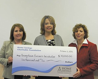 Youngstown Business Incubator, a charitable, nonprofit organization, recently was presented with a check for $10,000 from the Home Savings Charitable Foundations in support of its entrepreneurial support and development services. Holding the oversized check are. from left, Betty Jo Licata, Dean of Williamson College of Business at Youngstown State University; Trish Mohan, branch manager of Home Savings main office; and Barbara L. Ewing, chief operating officer of Youngstown Business Incubator. Located in downtown Youngstown, the incubator facilitates the creation of high-value businesses through collaborative partnerships that promote innovative technologies.