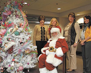 Members of Kids’ Crew of Akron Children’s Hospital Mahoning Valley are serving on the event committee for the Jingle Bell Bash, Breakfast with Santa and Holiday Trees of the Valley display that will benefit the hospital. Visiting with Santa, who will be a special guest at the breakfast, are, from left, Margaret Nigro, Joann Stock, Debbie Shattuck and Kelsey Rupert. PHOTO BY ROBERT K. YOSAY | THE VINDICATOR