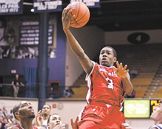 YSU junior guard Kendrick Perry (3) and senior forward Damian Eargle, bottom left, are two big reasons why
Penguin fans are so optimistic about this season. YSU begins its season on Saturday at George Washington.