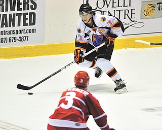 Phantoms forward Sam Anas (7) brings the puck up the ice while Dubuque’s Kyle Mckenzie defends during a recent game at the Covelli Centre.
