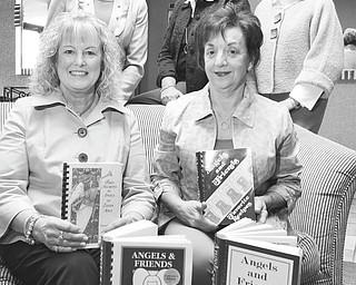 Angels of Easter Seals Holiday Brunch and Sweet Shoppe committee members, shown with copies of their cookbooks, are, seated, Lynn Sahli, left, reservations, and Joan Zarlenga, president; and standing are Jeannine Hodge and Joyce Dowell, co-chairwomen; and Cheri Raschilla, reservations. PHOTO BY: William D. Lewis | The Vindicator