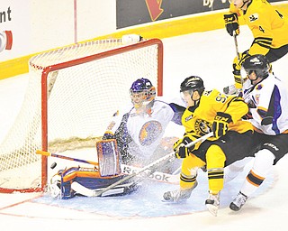 Green Bay’s Grigory Dikushin gets the puck past Phantoms goalie Sean Romeo for the Gamblers’ first goal of the game Sunday.