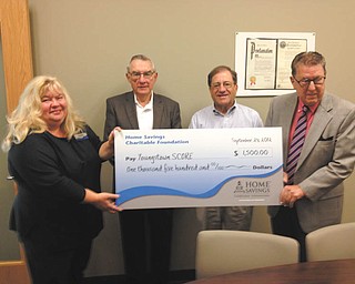 Home Savings Charitable Foundation recently presented a check for $1,500 to Youngstown S.C.O.R.E. Chapter 112, a nonprofit organization dedicated to entrepreneur education at Youngstown State University. Holding the check are, from left, Jeanne Watson-Antol, retail manager II, Home Savings YSU office; Steve Spencer, treasurer; Sam Roth, fundraising chairman; and Ed Stahura, chairman. S.C.O.R.E., also known as Counselors to America’s Small Business, supports the formation, growth and success of small business. The chapter has 38 volunteers and provides free confidential business counseling and workshops for both start-up entrepreneurs and current small business owners. For information about S.C.O.R.E. call 330-941-2948 or visit www.youngstown.score.org.