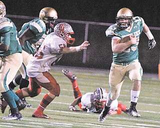 Ursuline quarterback Chris Durkin (13) breaks through the Cuyahoga Heights’ defense during the Division 5, Region 17 semifinal in Copely. The Irish, four-time state champions, face the defending state champion Kirtland Hornets on Saturday in a matchup that everyone has been waiting for — well everyone but their coaches, that is.