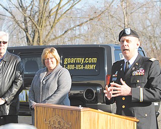 From left, Joe Kerola, president and CEO of P.I.&I. Motor Express, his wife, Pam Kerola, and Army Lt. Col. David P. Barlet, commander of U.S. Army Recruiting Battalion in Cleveland, finalized a partnership between the trucking business and the Army on Thursday. The agreement will allow preferential hiring for veterans interested in working for the company.