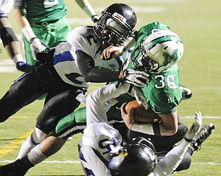 ROBERT K. YOSAY | THE VINDICATOR --..Mogadores #36 Gary Strain is stopped at the 4 yard line by YCS #2 Darien Townsend and #15 Robert Thompson..YCS vs Mogadore at Ravenna...(AP Photo/The Vindicator, Robert K. Yosay)