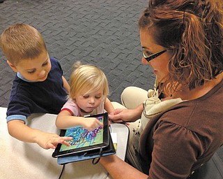 Connie Spin of Boardman attended an iPad story time at the Newport Branch with her daughter, Sydney, 2, and son, Jackson, 4. “They like to play on the iPad and the iPhones a lot,” she said of her children.