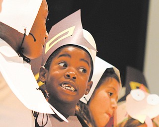 Nascere Smith, 7, helps entertain parents before a Thanksgiving feast at Campbell Elementary School. Second-graders and their parents enjoyed turkey and all the trimmings Monday afternoon.