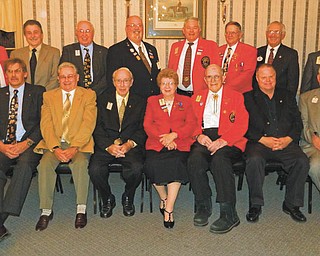 Past District Governors of area Lions Clubs who met recently at A La Cart Catering in Canfield are, in front from left, Chuck Allcorn, David Rice, Donald Martin, Verna Williams, Dwain Hawkins, Ron Clifton and Bud Jenkins. In back are, from left, Ted Filmer, Paul Metrovich, Bob Whited, Jeff Snyder, Bob Booher, Don Heldman, Governor John Woodside and Harold Ullman.