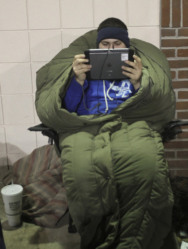 William d Lewis the Vindicator  Keeping warm in a sleeping bag while waiting outside Boardman Best Buy Thursday night was Mike Socie of Boardman.