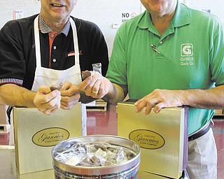 Brothers and Giannios Candy owners Greg, left, and John Giannios sample some of their candies at their Struthers
facility. U.S. candy sales reached $29.4 billion in 2010, according to the National Confectioners Association.