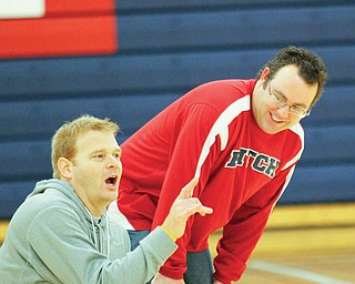 Dan Horacek watches coach John Hudson during a practice. Horacek teaches at the University Project Learning Center, an alternative school in the Youngstown district.