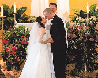 For Marie and Bob LaCivita of Liberty, the May 26 wedding of their daughter, Marlana, and Guy Harris of Tampa was a joyous occasion. The Very Rev. John Keehner of Youngstown, in the background, performed the ceremony at St. Mary Church in Tampa.