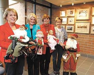 The Holiday Hopes and Wishes committee prepares for the Dec. 14 luncheon, bake shoppe and basket raffle to benefit Akron Children’s Hospital Mahoningn Valley at Mr. Anthony’s in Boardman. From left are Dynna Hayat, Betty Cmil, Julie Costas and Kathy Dwinnells. PHOTO BY: ROBERT K. YOSAY | THE VINDICATOR