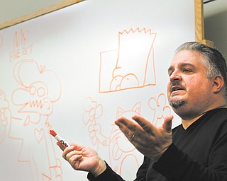 Chris Yambar, a comic-book writer and artist who has worked on “The Simpsons” comic book, speaks to members of the Young Adult Club of Hubbard Public Library. Yambar made a presentation at the library Tuesday.