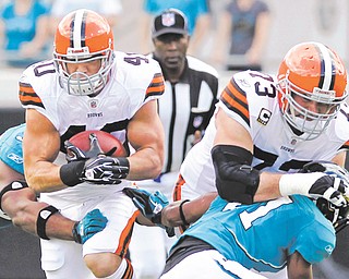Cleveland Browns left tackle Joe Thomas (73) once blocked and did all he could to protect Peyton Hillis (40. But on Wednesday, Thomas blasted his former teammate, calling Hillis “a terrible distraction” and saying the running back put his contract situation ahead of the team. Hillis is returning to play in Cleveland on Sunday with the Kansas City Chiefs.