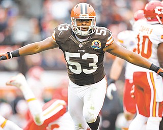 Cleveland Browns linebacker Craig Robertson (53) celebrates after making a tackle against the Kansas City Chiefs during an NFL game in Cleveland on Sunday. The Browns won 30-7.