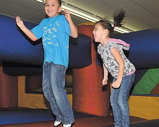 Isaac and Izabella Melendez, of Austintown, have a good time and are all smiles at Austintown Bounce. Austintown Bounce Indoor Play Center had an event Tuesday to teach bounce-house safety.
