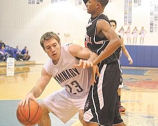 Poland’s Alex Hubbell tries to get to the hoop as Campbell Memorial’s Daron Clinkscale defends Tuesday night.