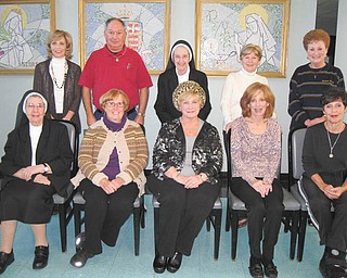The Valentine’s Day Dinner committee at the Ursuline Center, 4280 Shields Road, Canfield, is planning the sixth annual event for 6:30 p.m. Feb. 14 in the center’s auditorium. Committee members seated are Sister Francis Marie Sopko, left, Eileen Novotny, Maggie Wellington, Sue Ricciutti and Peggy Eicher. Those standing are Joan Sonnett, left, Ray Novotny, Sister Jeanne Cigolle, Betty Clarke and Mary Yvo Assion. Tickets will be $25 and will include appetizers, entree, dessert, wine bar and entertainment. Canfield’s Broad Street Diner will cater. Proceeds will benefit the ministries of the Ursuline Sisters of Youngstown. For tickets or information, call Peggy Eicher at 330-717-6806.