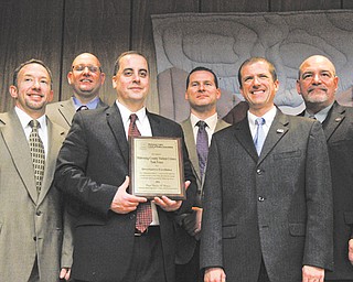 The Mahoning Valley Violent Crimes Task Force received an award at a luncheon for its work in stopping gang activity in the city. Pictured are six of the dozen task-force members recognized during the luncheon, which was put on by the Mahoning Valley Chiefs of Police Association.