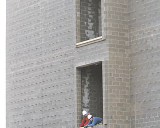 Work continues at the Austintown schools complex as windows and roofing are put into place. Construction for the new buildings, which will house kindergarten through fifth-grade classes, is right on schedule.