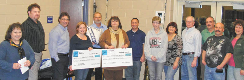 Hubbard Schools Band Sponsors won an aluminum can fund drive sponsored by the Ball Corp. for the third year in a row. Representatives from the local Ball Corp. plant in Hubbard were on hand at a recent boosters meeting to present the members with a check for $2,500 along with a check for an additional $2,500 of matching funds from the local plant. The Hubbard Band Sponsors have received over $10,000 in the last three years from the Ball Corp. All money goes into a fund for new uniforms. Pictured are, from left,  Ball personnel Amy Braden, Gary Flamino and Bob Truckiss; Andrea Lewis, assistant band director; Bernie Grilli, Ball Corp.; Cathy Cummings, boosters president; Dan Nestich, school band director; Pam Reiter, boosters vice president; Sandy Kerr, boosters treasurer; Ron Emch, boosters secretary; Chet Julian, Ball Corp.; and Sal Halicki and Maria Castner, boosters trustees.