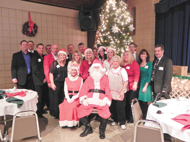 Youngstown Lions Club’s 92nd Annual Christmas party for students of Youngstown City Schools had the Saxon Club filled to capacity. The children enjoyed singing and dancing to Christmas carols, eating a turkey dinner and opening their gifts from Santa, Mrs. Claus and the Lions Elves. Shown are members of the Lions Club, who had as much fun as the children.