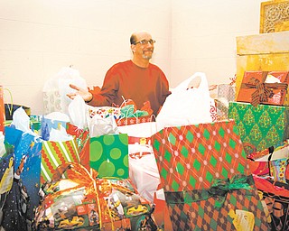 Tony Lape, a member of St. Patrick Church in Youngstown, expresses gratitude for all the Christmas gifts earmarked for children of inmates. He coordinates the Angel Tree ministry that has been at St. Patrick for about a dozen years.