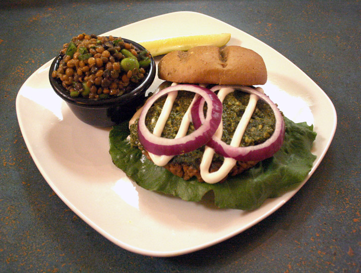 Flaming Ice Cube's vegan Pesto Burger served with a side of Edmame Salad.