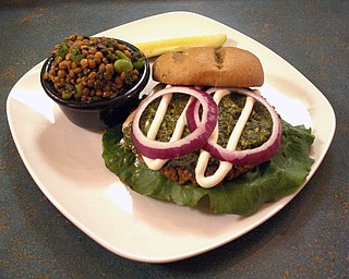 Flaming Ice Cube's vegan Pesto Burger served with a side of Edmame Salad.