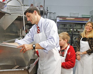 MADELYN P. HASTINGS | THE VINDICATOR..Paul Ryan visits St. Vincent De Paul Society in Youngstown, Ohio after his speech at YSU on October 13, 2012. He and his family put on aprons and helped the staff wash dishes. ... - -30-..