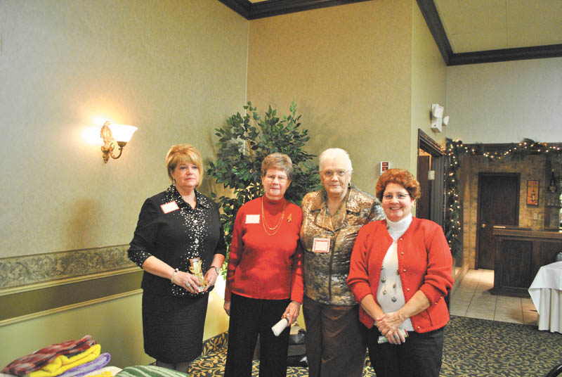 Niles Chapter of the American Sewing Guild officers are shown at a recent holiday party at Ciminero’s Banquet Center, Niles. Barbara Rosier-Tryon, left, president; Marion Gibson, first vice president; Lynn Price, treasurer; and Diane Wittik, second vice president. Gretchen Saunders, secretary, was absent.