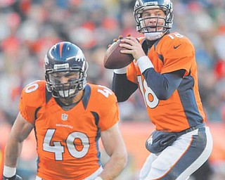Denver Broncos quarterback Peyton Manning drops back to pass behind the blocking by running back Jacob Hester during Sunday’s game against Cleveland. In a season besmirked by tragedies and scandals, 2012 also will be known as The Year of the Comeback in the NFL, with some of the game’s greats — including Manning — not only regaining their old form, but somehow surpassing it.