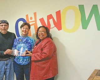 Suzanne Barbati, center, OH WOW! executive director, is shown with Ronald Faniro and Madonna Chism Pinkard, who received OH WOW! service awards as outgoing members of the board.