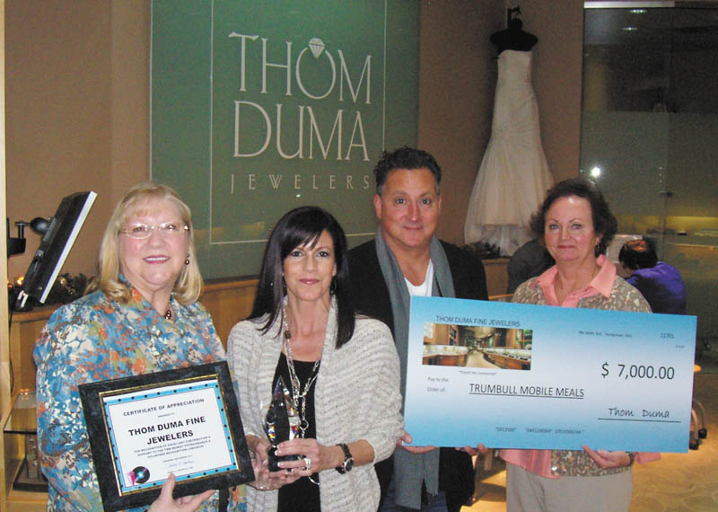Trumbull Mobile Meals Inc. was the beneficiary of the generosity of Jacki and Thom Duma, center, of Thom Duma Fine Jewelers at their annual Basket Extravaganza. The jewelers donated a $6,000 diamond and a cubic zirconia for each of the 100 baskets in the silent auction. The winner of the silent auction basket redeemed the zirconia for the diamond at the end of the evening. Also shown are Sandee Mathews, left, chief executive officer of Trumbull Mobile Meals, and Kathy Keeler, mobile meals office manager.