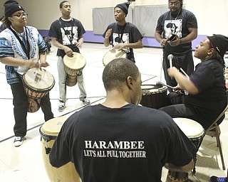 William D Leiws the Vindicator Harambee drum corp plays during Kwanzaa celebrationTuesday at McGuffey Centre.