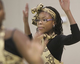 William D Leiws the Vindicator Jade Frazier, 12, member of Harambee dancers performs plays during Kwanzaa celebration Tuesday at McGuffey Centre.
